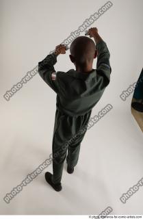 ERIC STANDING POSE WITH GUNS